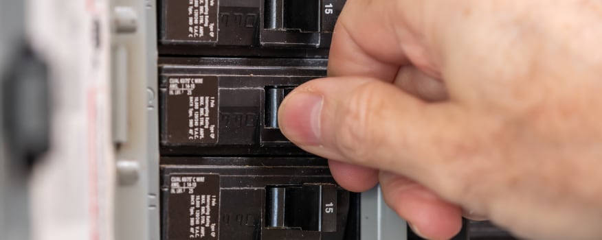 An expert demonstrating how to test a circuit breaker